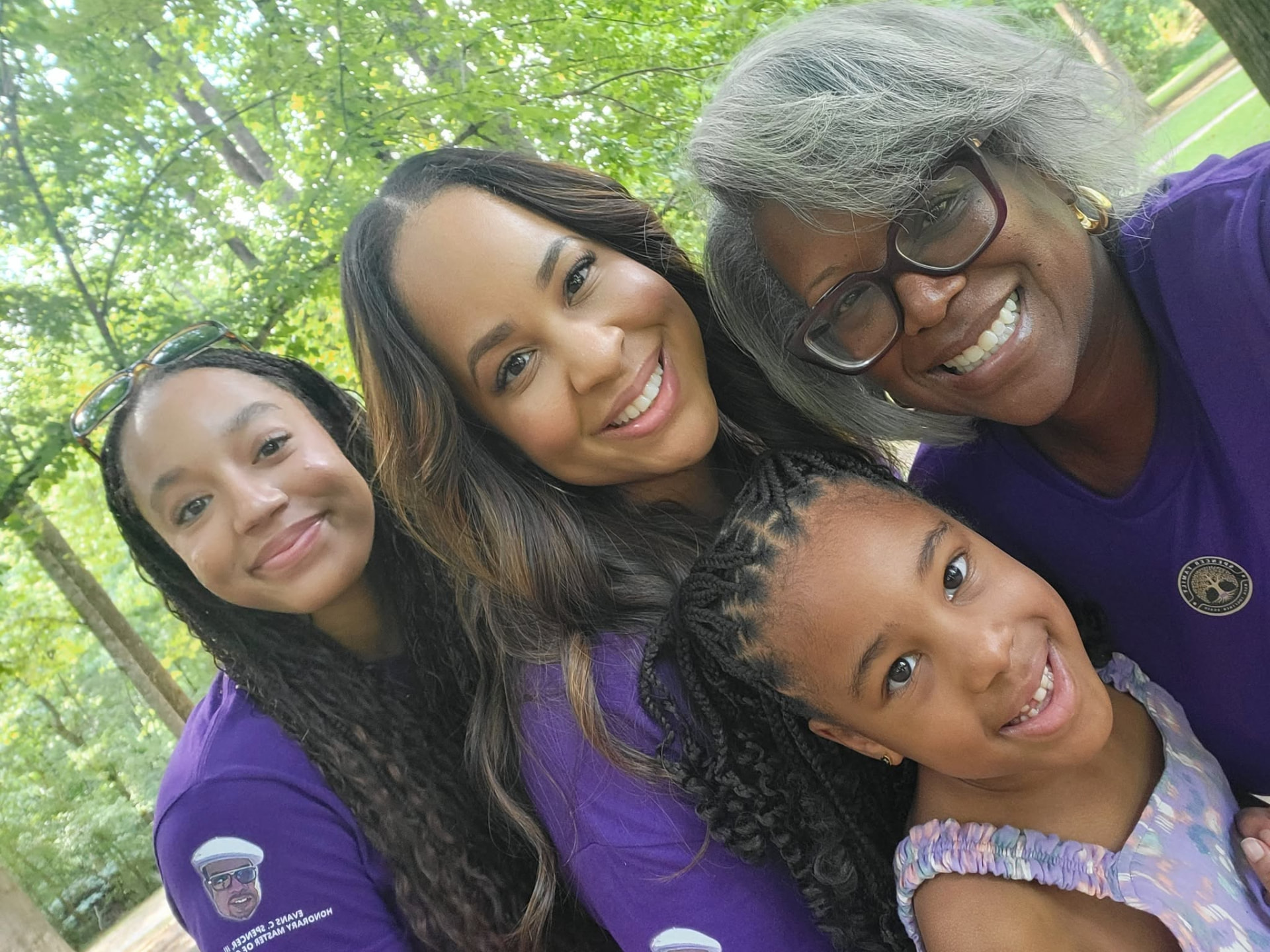 Four generations of Spencer women smiling together