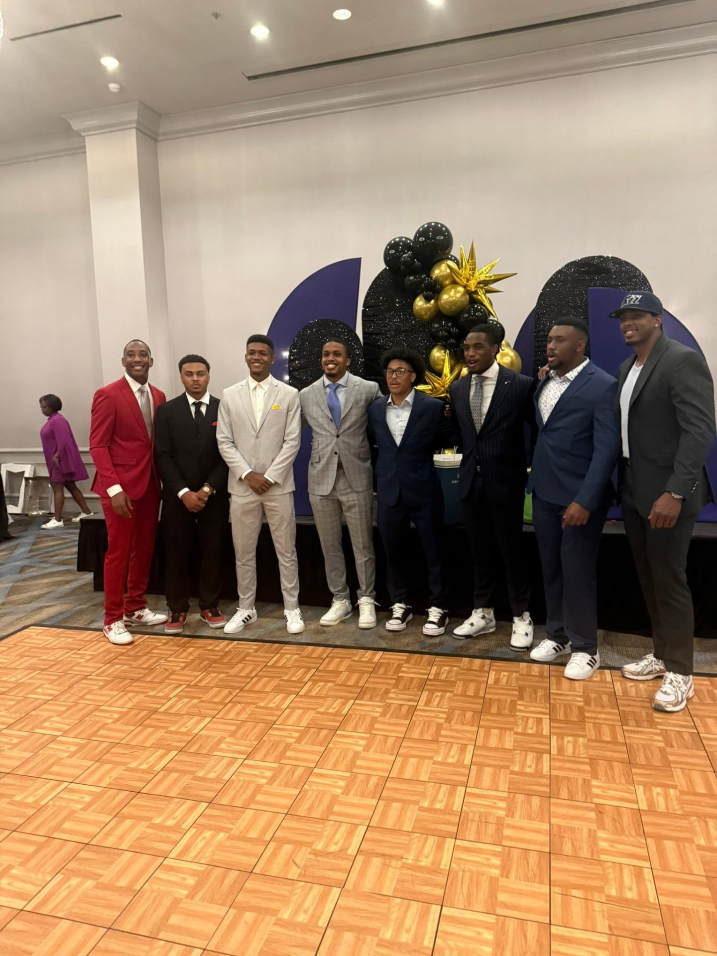 Spencer family young men in suits at the reunion banquet