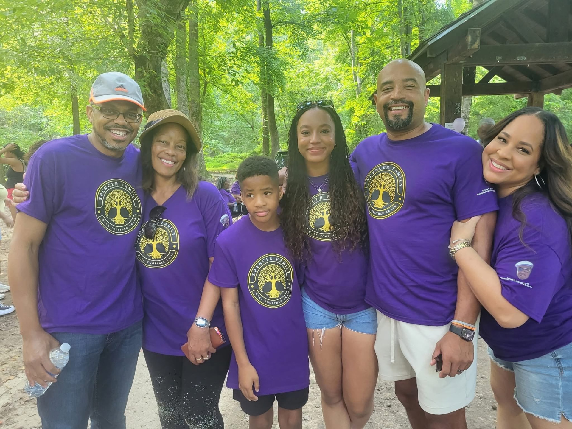 Spencer family in matching purple family tree reunion shirts