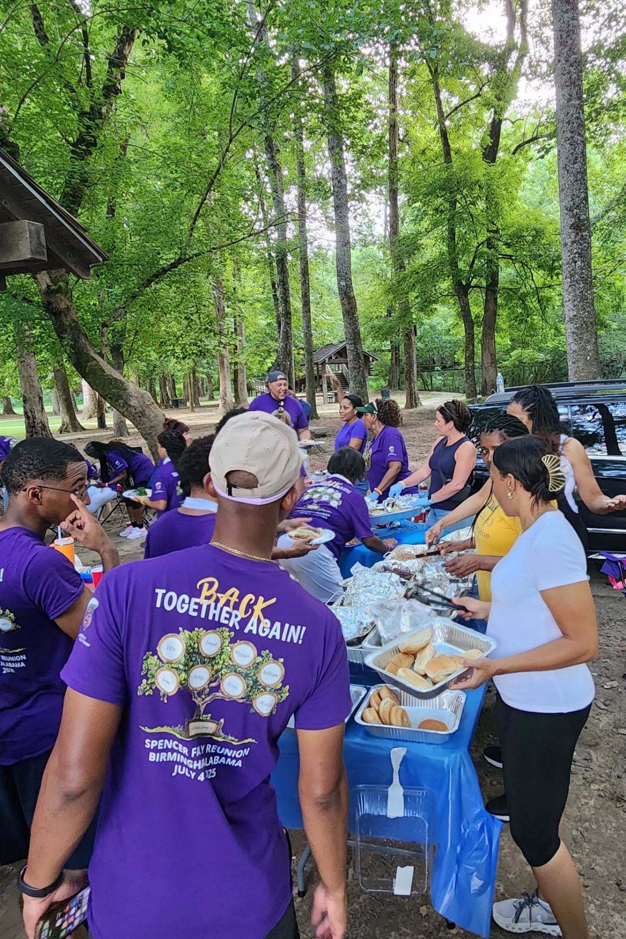 Spencer family sharing a cookout meal at the park pavilion