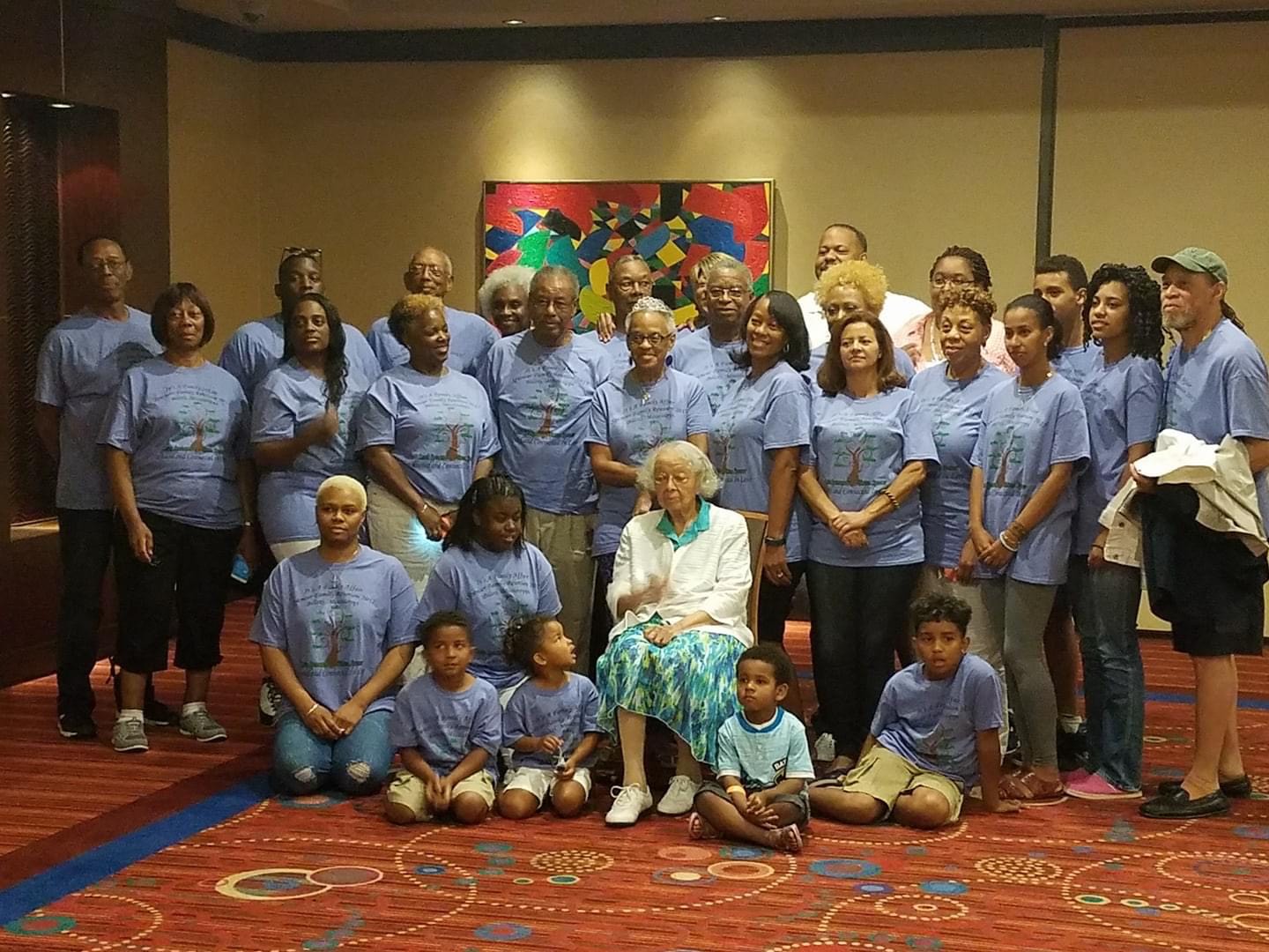 Spencer family members in matching blue family tree reunion shirts